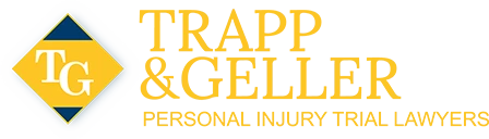 Logo for Trapp & Geller, personal injury trial lawyers, featuring yellow text and the initials "TG" on a blue and yellow diamond shape.