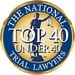 A gold and blue badge reading "The National Trial Lawyers Top 40 Under 40" with a statue of Lady Justice holding scales in the center.