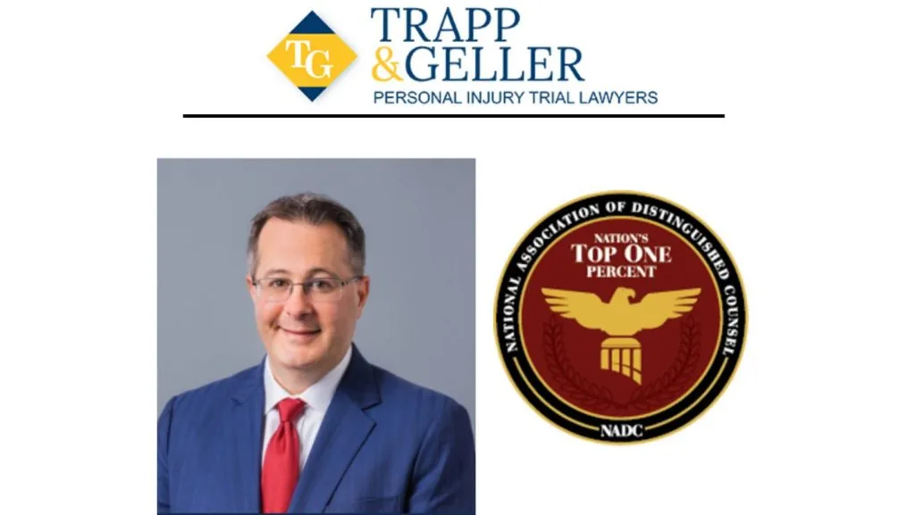 A man in a blue suit and red tie is pictured next to the National Association of Distinguished Counsel Top One Percent badge and the Trapp & Geller law firm logo.